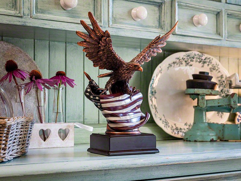 Patriot-Urn The Eagle & Flag are beautifully represented in the stunning Patriot Memorial Keepsake Urn. Cast in resin with copper plate and enamel figurine on a matte black plinth